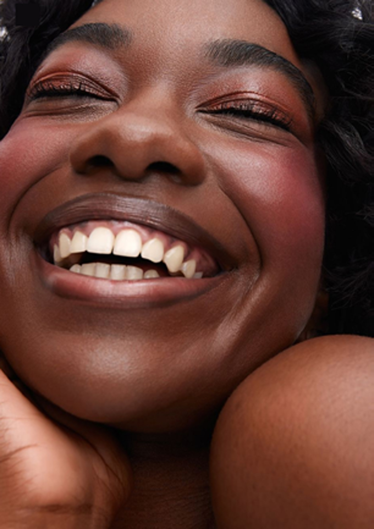 Smiling woman with her eyes closed